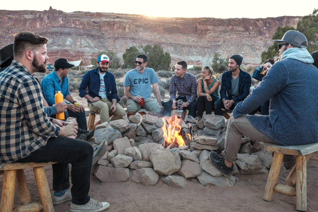 Friends round a campfire